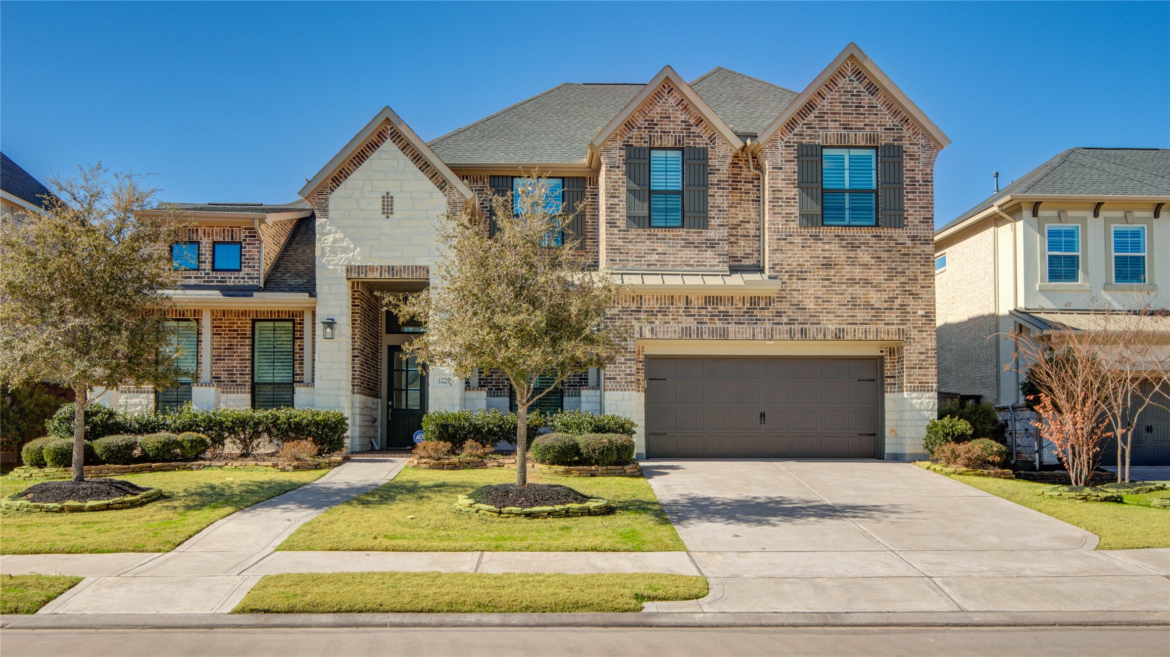1222 McMurtry Ridge Drive Katy, TX 77494 - Photo 1 of 49 a front view of a house with garden