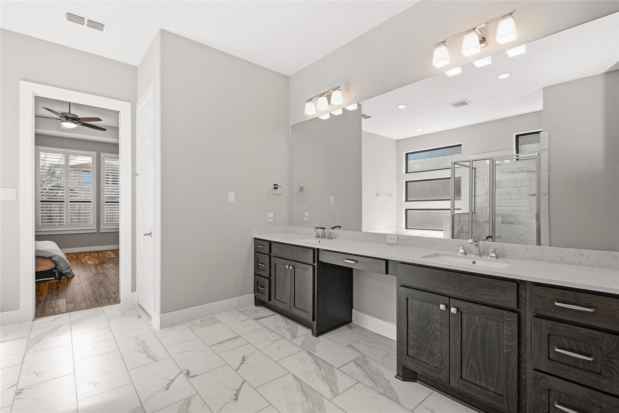 1222 McMurtry Ridge Drive Katy, TX 77494 - Photo 42 of 49 a spacious bathroom with a double vanity sink a mirror and a shower