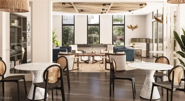 a dining room with furniture and large windows