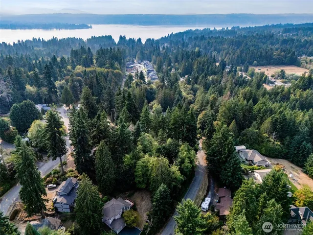 an aerial view of a house with mountain view