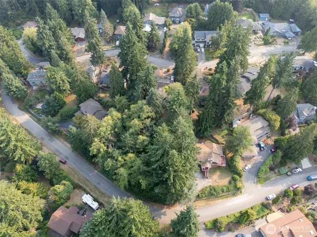 an aerial view of a houses with yard