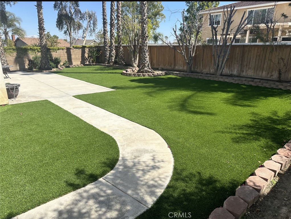 11306 Trailstone Court Riverside, CA 92505 - Photo 11 of 47 a view of a swimming pool with a sitting area