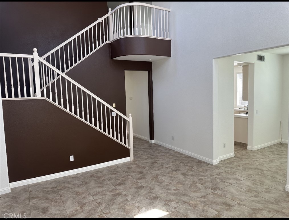 11306 Trailstone Court Riverside, CA 92505 - Photo 13 of 47 a view of a hallway with wooden floor and entryway