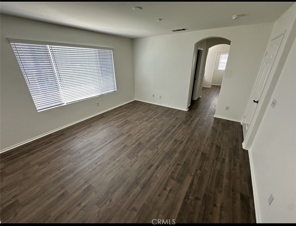 11306 Trailstone Court Riverside, CA 92505 - Photo 17 of 47 wooden floor in an empty room with a window