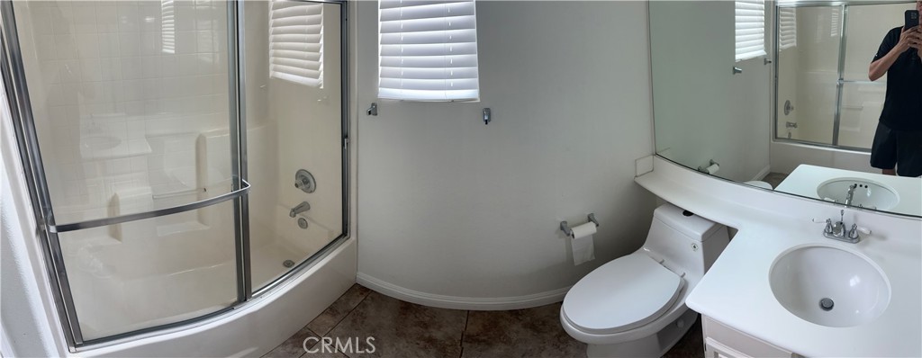 11306 Trailstone Court Riverside, CA 92505 - Photo 28 of 47 a white toilet sitting next to a bathroom sink