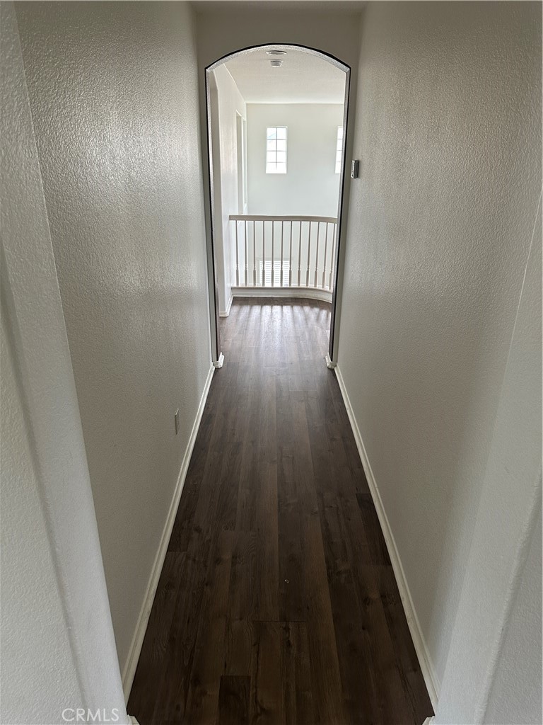 11306 Trailstone Court Riverside, CA 92505 - Photo 32 of 47 a view of a hallway with wooden floor and entryway
