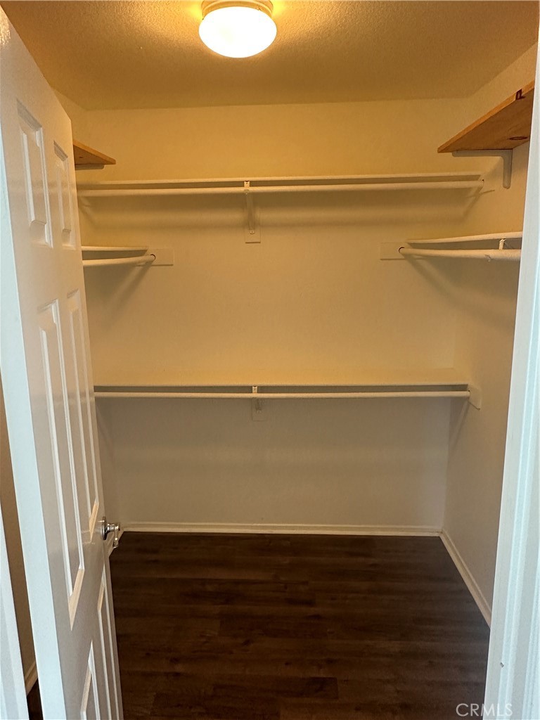 11306 Trailstone Court Riverside, CA 92505 - Photo 39 of 47 a view of closet with wooden floor