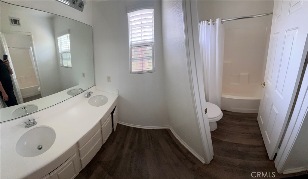 11306 Trailstone Court Riverside, CA 92505 - Photo 43 of 47 a bathroom with a sink a toilet and a shower