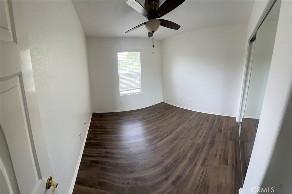 11306 Trailstone Court Riverside, CA 92505 - Photo 46 of 47 wooden floor in an empty room with a window