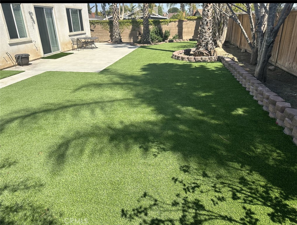 11306 Trailstone Court Riverside, CA 92505 - Photo 10 of 47 a backyard of a house with table and chairs