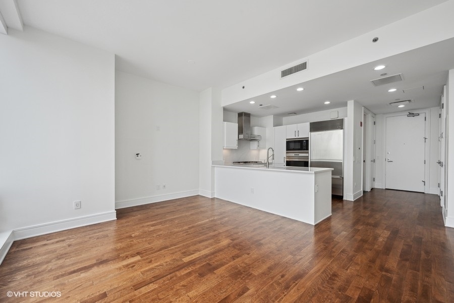 401 North Wabash Avenue, Unit 42E Chicago, IL 60611 - Photo 11 of 55 a view of kitchen with wooden floor