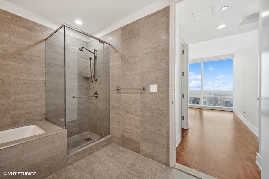 401 North Wabash Avenue, Unit 42E Chicago, IL 60611 - Photo 14 of 55 a bathroom with a shower and a bathtub