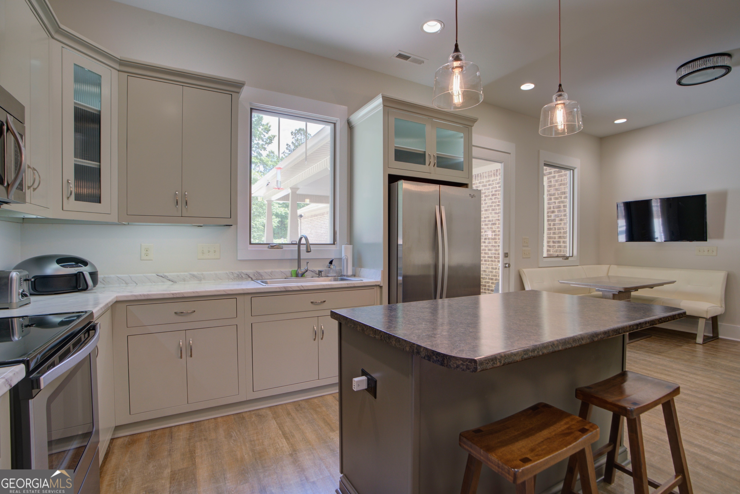 610 Kings Bridge Road Cave Spring, GA 30124 - Photo 38 of 72 a kitchen with granite countertop a sink counter space and stainless steel appliances