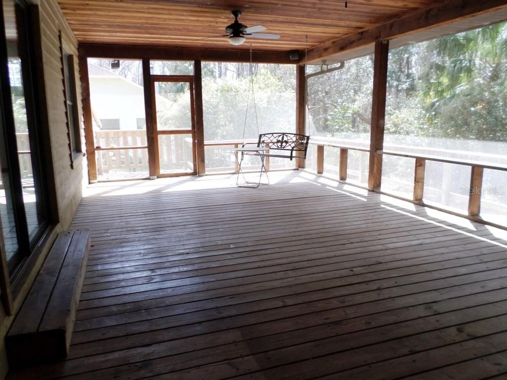 11606 Kennesaw Road Dunnellon, FL 34431 - Photo 23 of 33 a view of a room with wooden floor