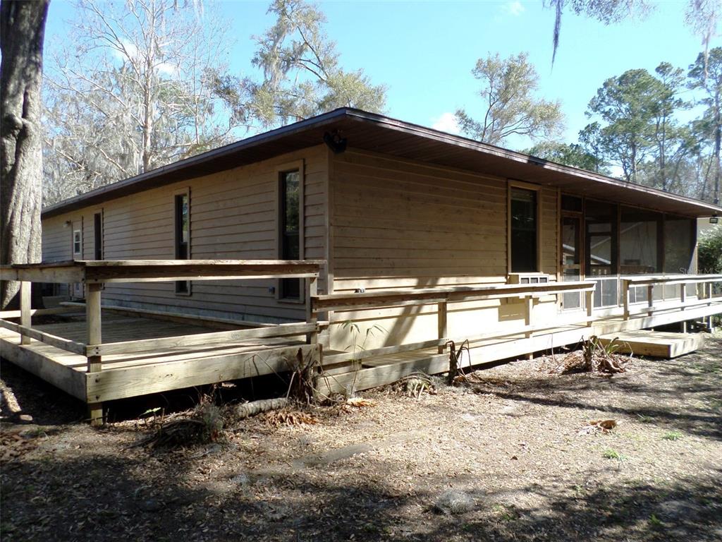 11606 Kennesaw Road Dunnellon, FL 34431 - Photo 26 of 33 a backyard of a house with wooden fence and floor