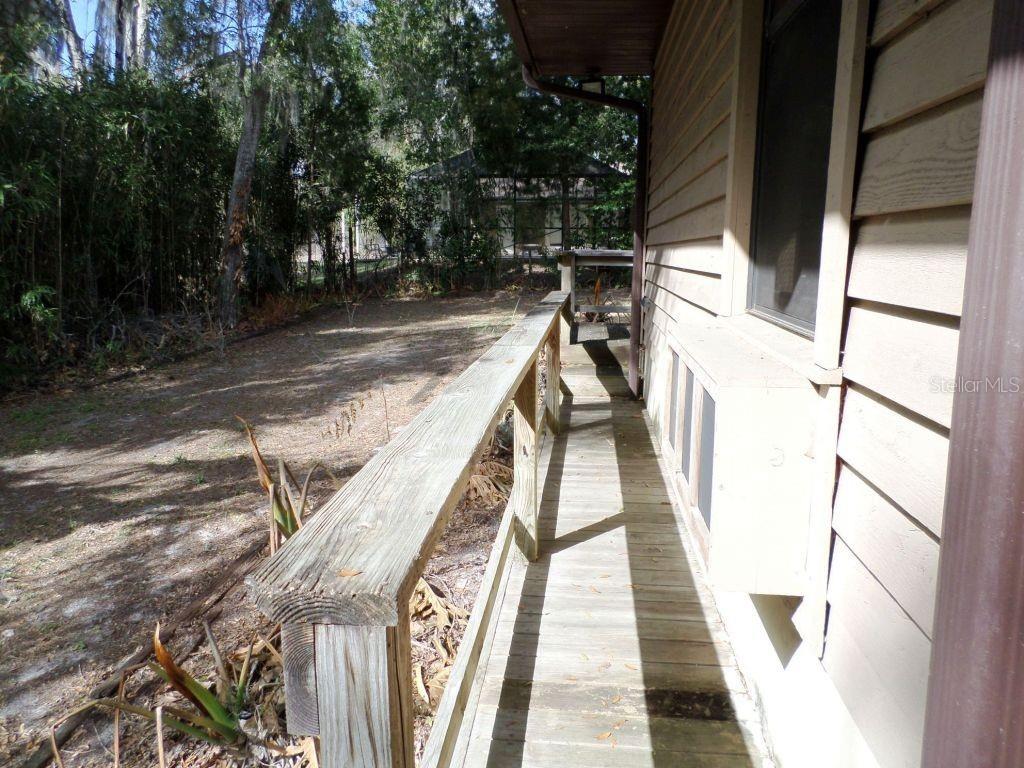 11606 Kennesaw Road Dunnellon, FL 34431 - Photo 29 of 33 a view of balcony with wooden floor and fence