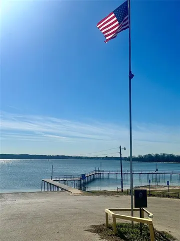 a view of swimming pool with outdoor seating and city view