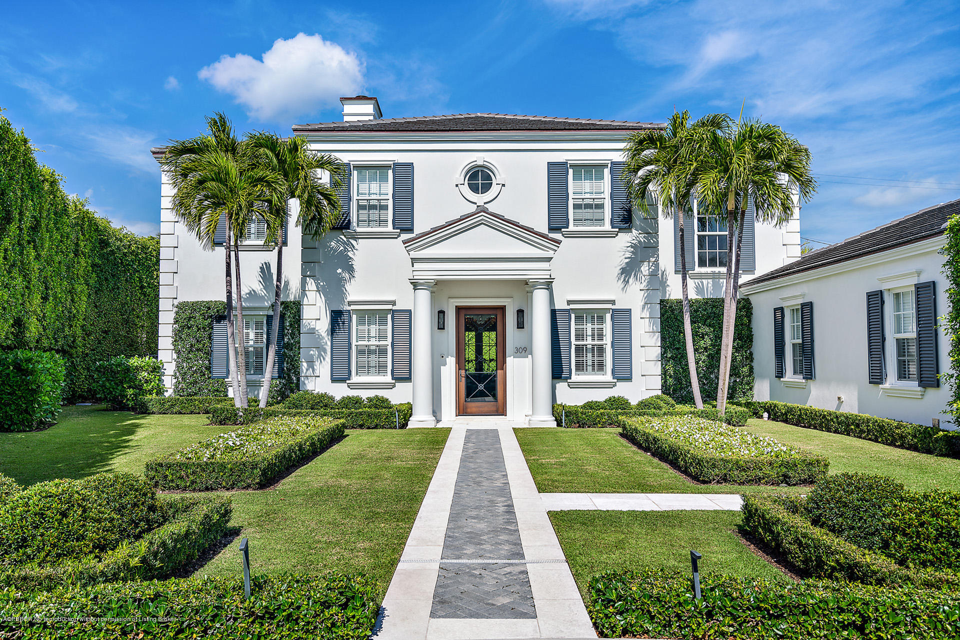 a front view of a house with garden