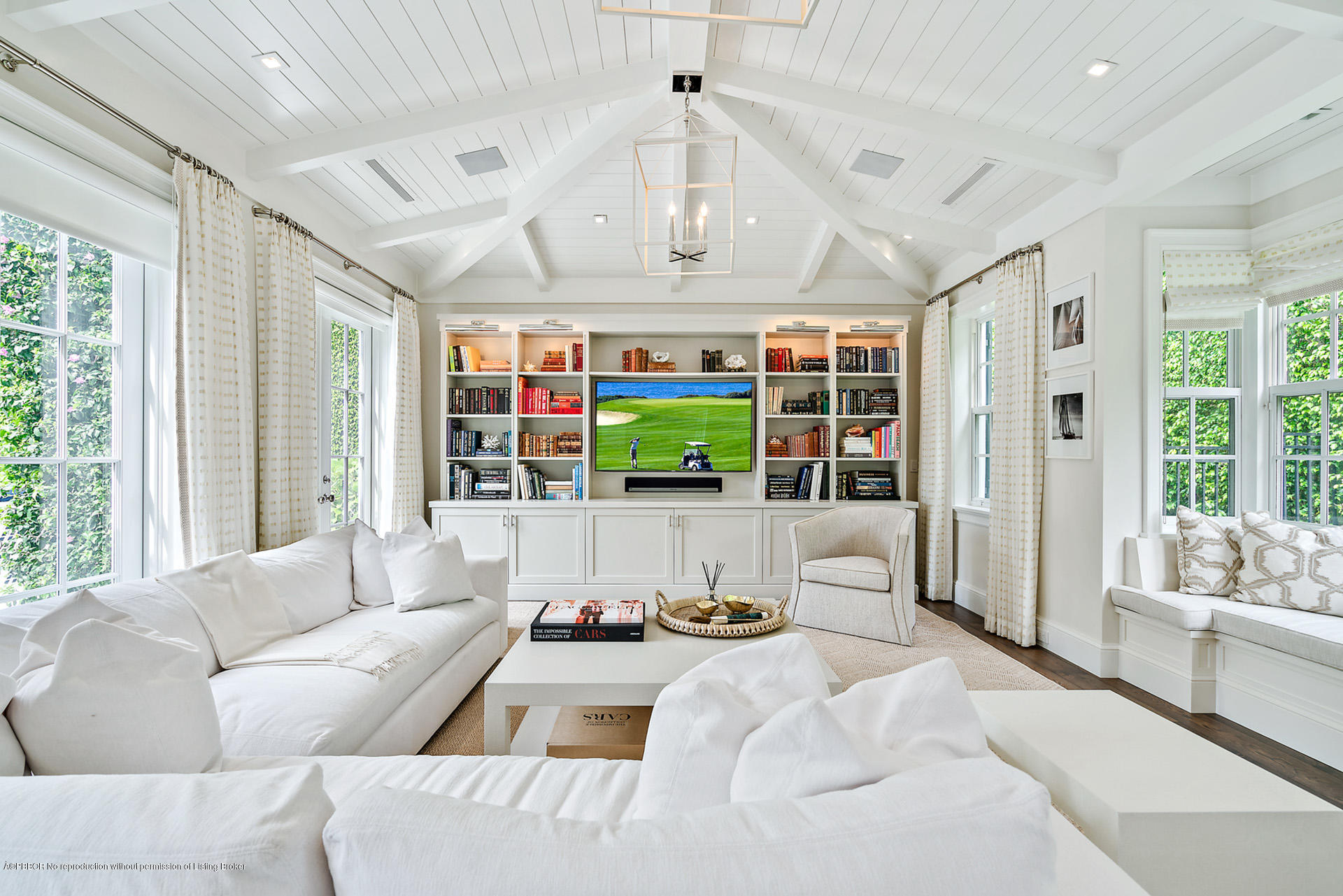 309 Dunbar Road Palm Beach, FL 33480 - Photo 14 of 24 a living room with furniture large window and flat screen tv