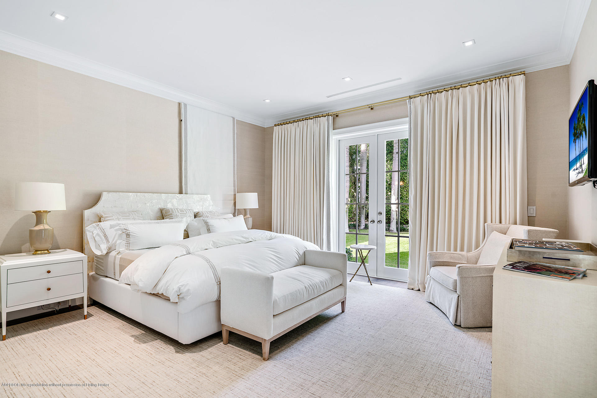 309 Dunbar Road Palm Beach, FL 33480 - Photo 15 of 24 a spacious bedroom with a bed and a large window