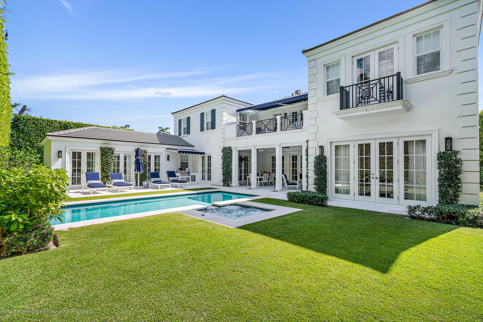 309 Dunbar Road Palm Beach, FL 33480 - Photo 23 of 24 a front view of a house with swimming pool having outdoor seating