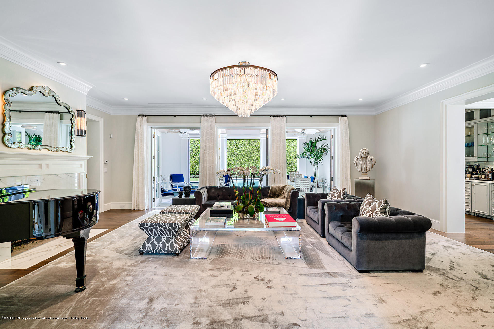 309 Dunbar Road Palm Beach, FL 33480 - Photo 5 of 24 a living room with furniture chandelier and a window