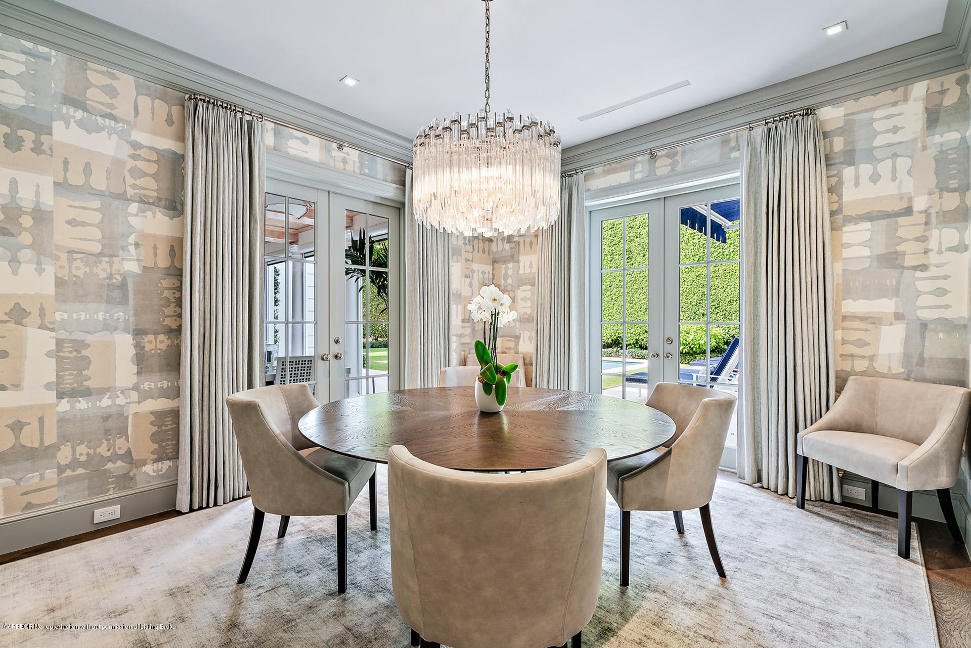 309 Dunbar Road Palm Beach, FL 33480 - Photo 6 of 24 a dining room with furniture large windows and a chandelier