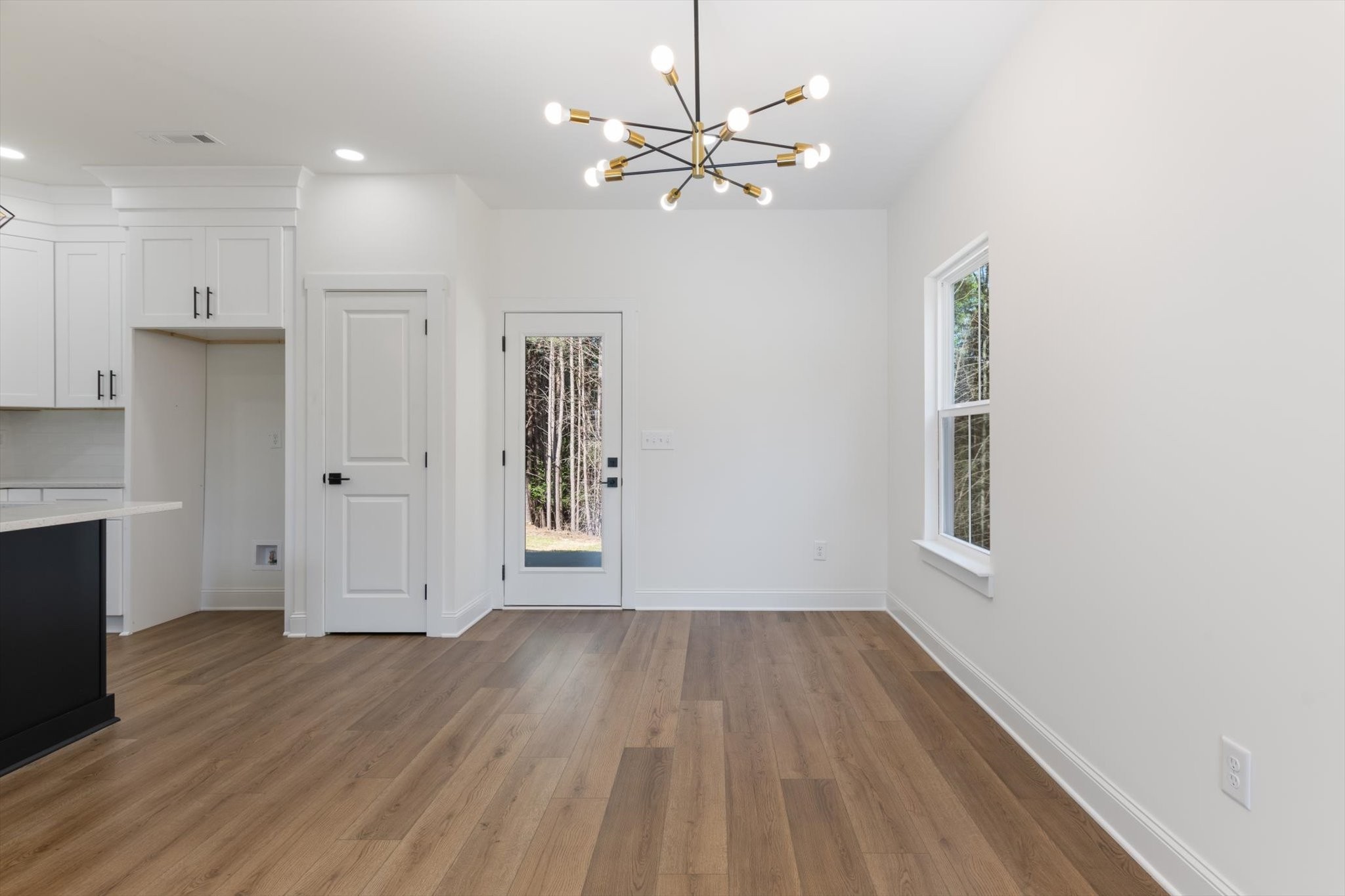 537 Shelton Road Manchester, TN 37355 - Photo 11 of 36 a view of an empty room with wooden floor and a window