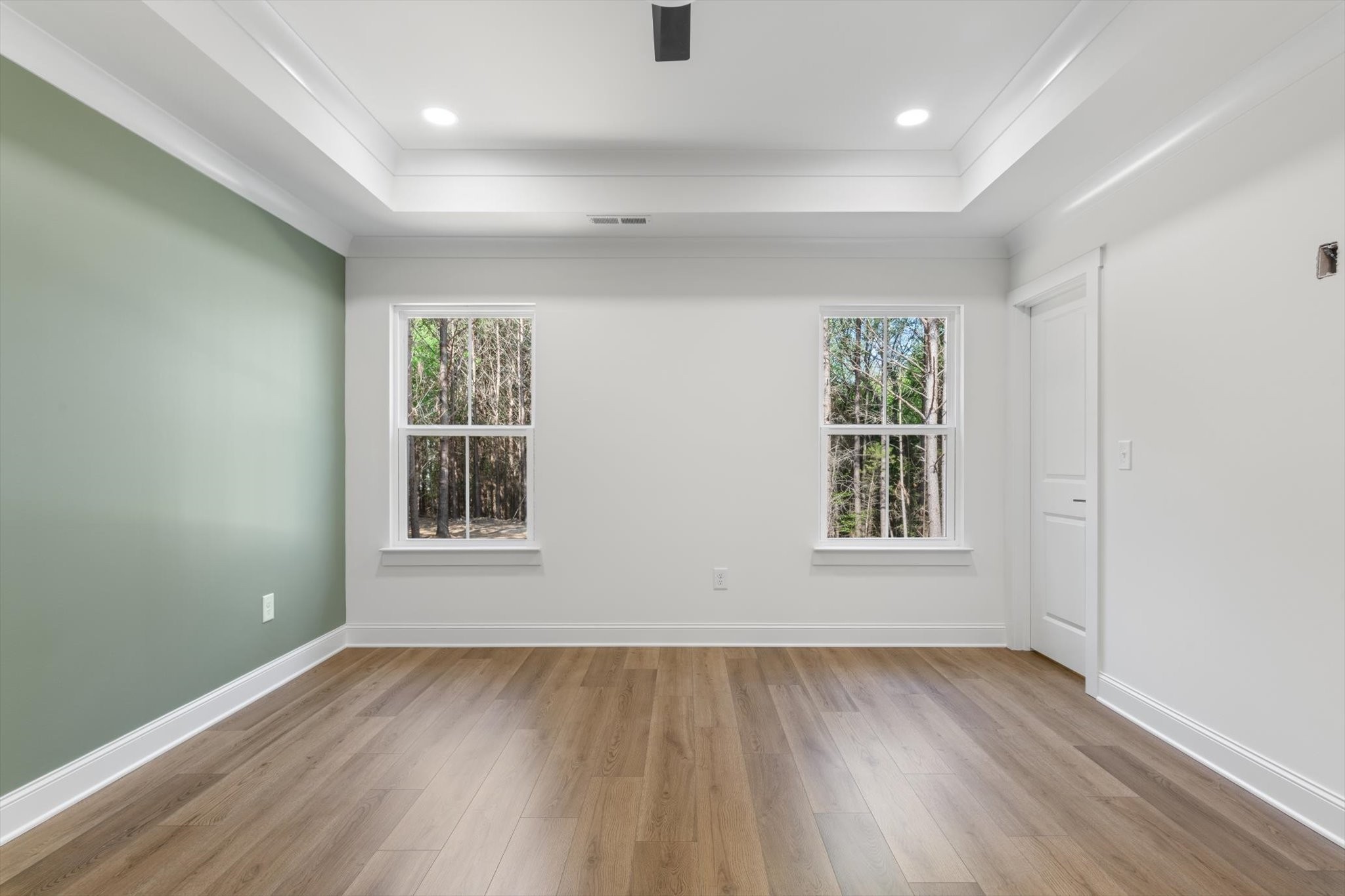 537 Shelton Road Manchester, TN 37355 - Photo 13 of 36 an empty room with wooden floor and windows
