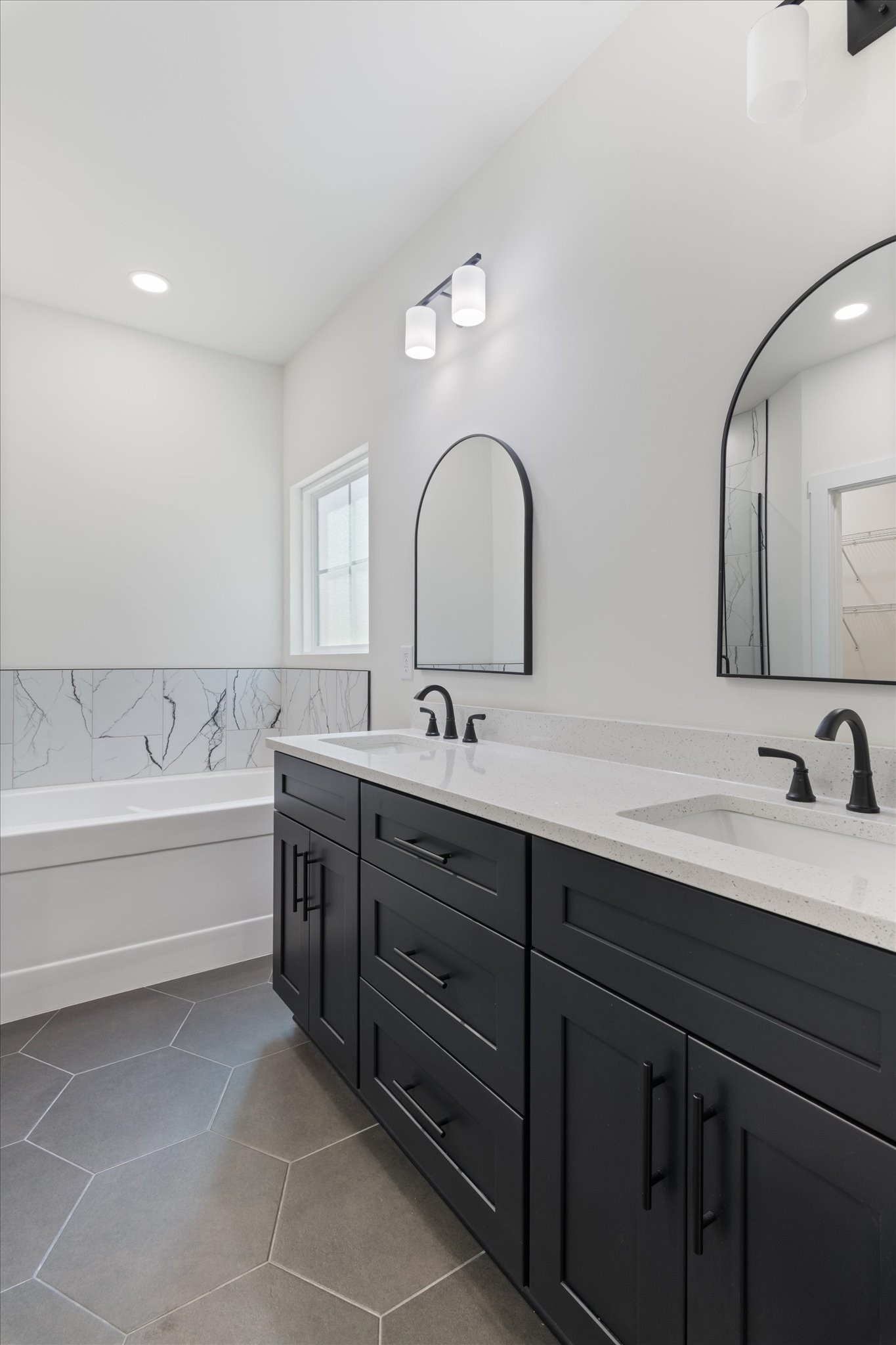 537 Shelton Road Manchester, TN 37355 - Photo 15 of 36 a spacious bathroom with a double vanity sink double mirror and bathtub