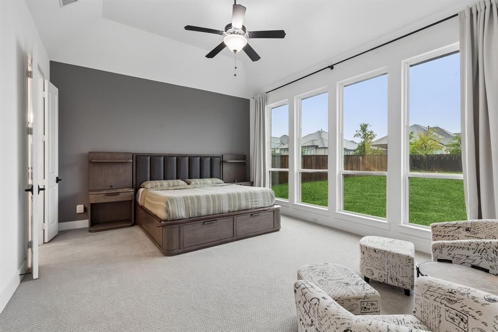 566 Broadleaf Way Haslet, TX 76052 - Photo 5 of 38 Expansive room featuring a vaulted ceiling and a ceiling fan with integrated lighting