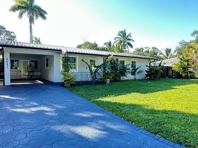 a house view with a garden space