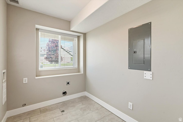 857 225 South Springville, UT 84663 - Photo 9 of 23 Utility room featuring light neutral wall paint, a window with horizontal blinds, and ceramic tile flooring