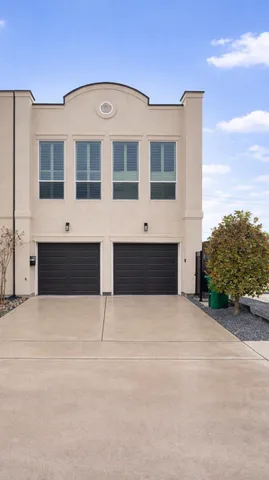 a front view of building with yard