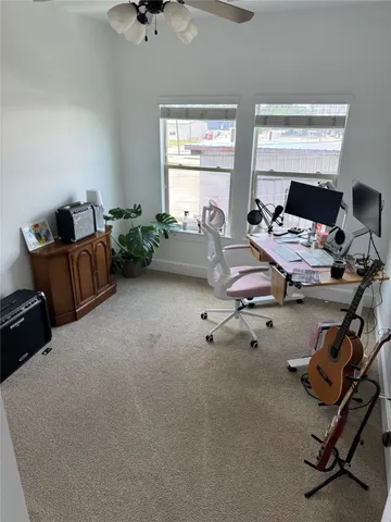 a view of a backyard with table and chairs and potted plants