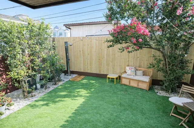 a view of a backyard with a garden and plants