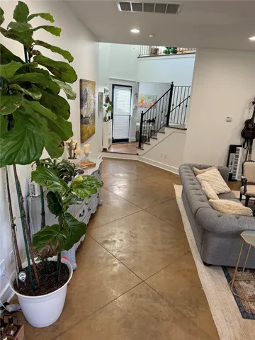 a spacious bedroom with a bed and a couch