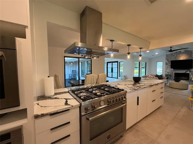 a kitchen with a table and chairs in it