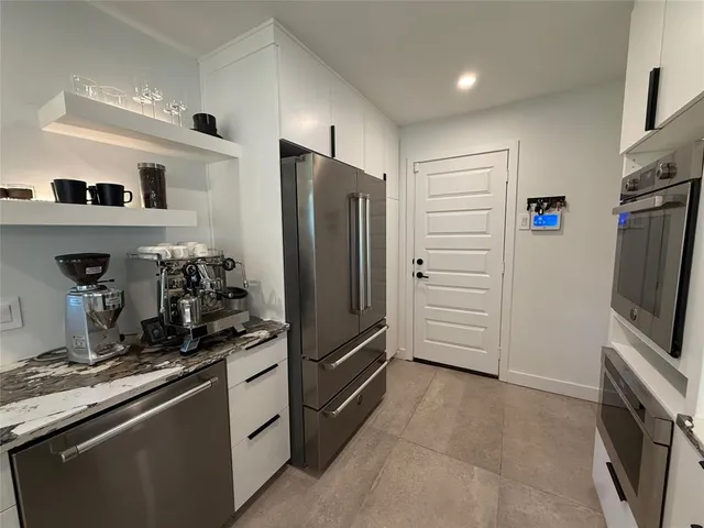 a bedroom with a bed and a mirror