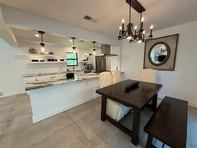 a large white bed in a hotel room