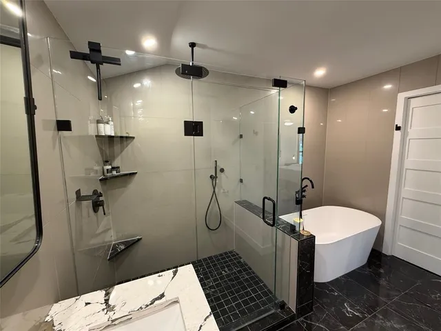 a bedroom with a bed and a night stand