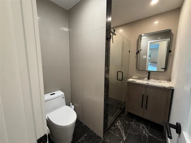 a view of a backyard with large trees