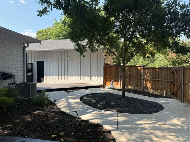 a view of a backyard with sitting area