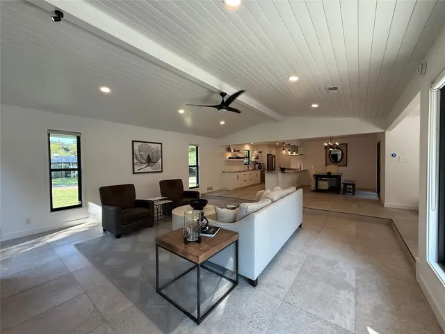 a kitchen with stainless steel appliances granite countertop a sink and a stove