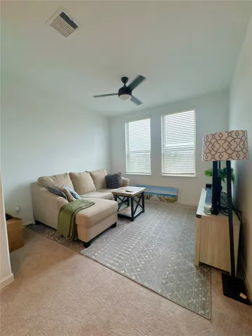 a living room with furniture and a window