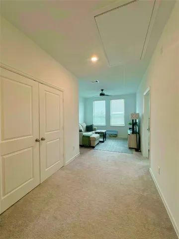a view of hallway with livingroom