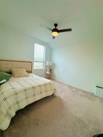 a bedroom with a bed and a cabinets