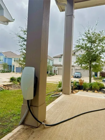 a view of a patio with table and chairs and potted plants