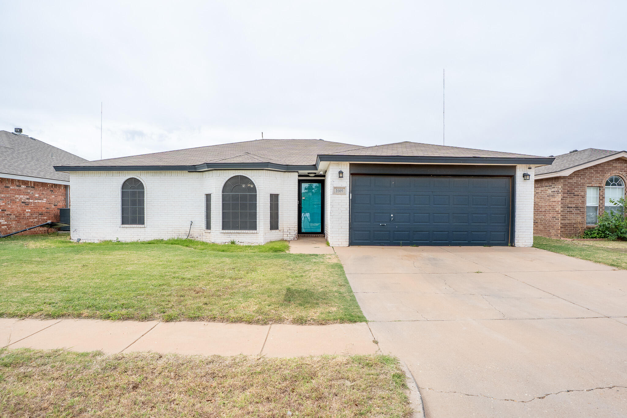 1609 78th Street Lubbock, TX 79423 - Photo 2 of 36 a front view of house with yard