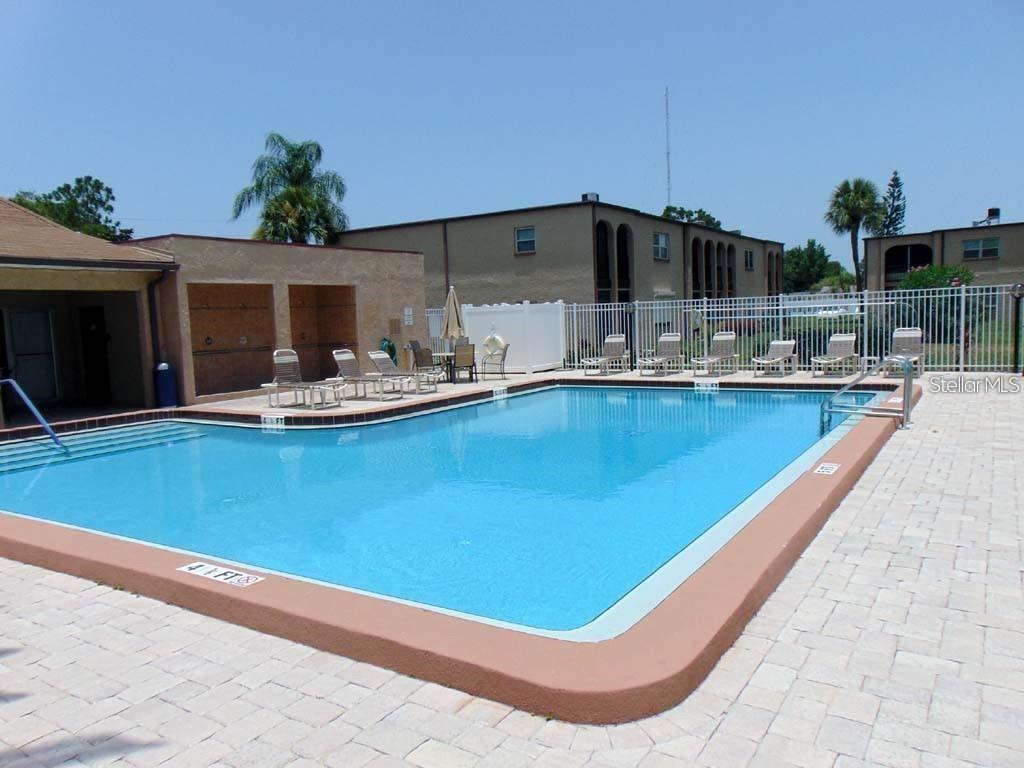 7701 Starkey Road, Unit 731 Seminole, FL 33777 - Photo 19 of 19 a view of a swimming pool with outdoor seating